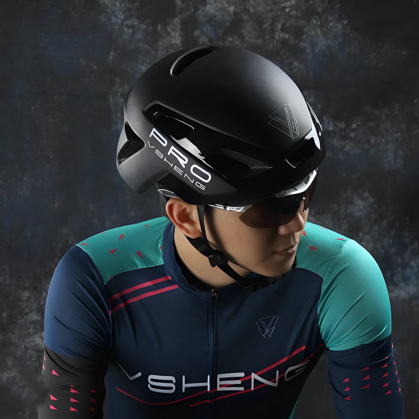 Road bicycle safety helmet in black with visible vents and adjustable buckle