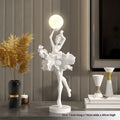 Small modern resin night light ornament with USB charging cable in black gold colour.