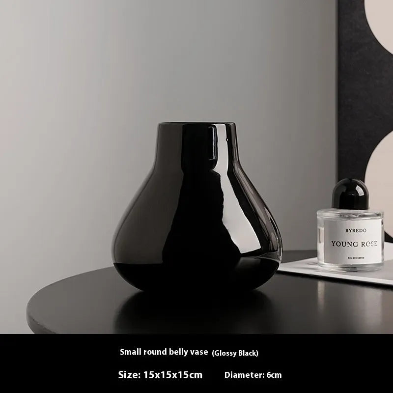 Black ceramic round belly vase with glass surface and coloured glaze decoration