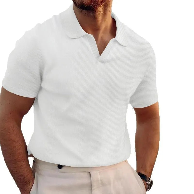 Man wearing a slim fit black heavy waffle knit t-shirt with short sleeves.
