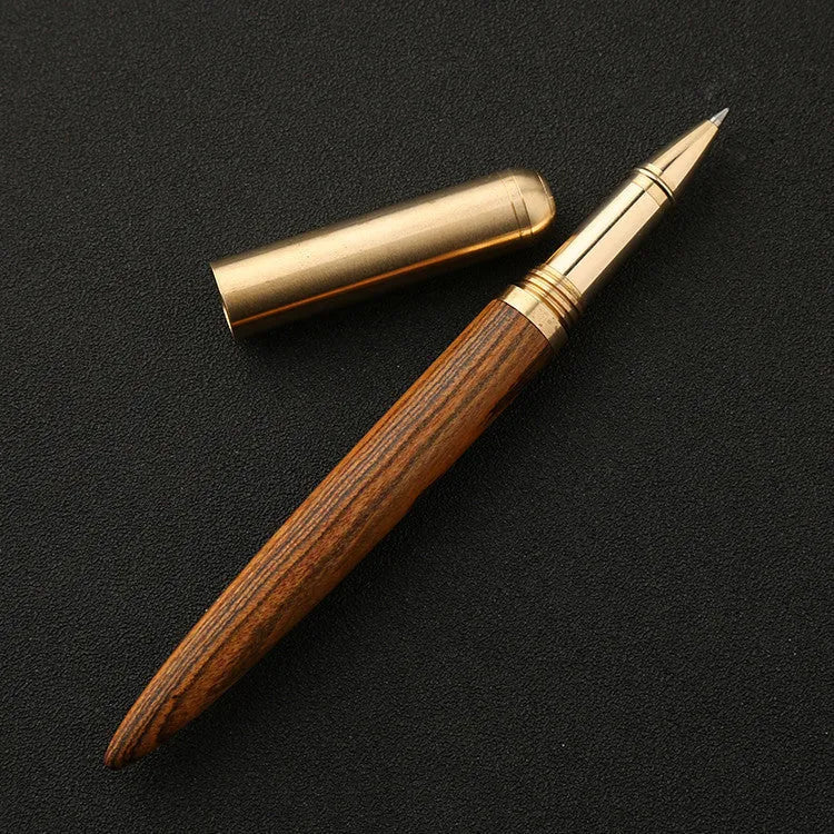 Brass and solid wood signature pen showing wood grain and metallic details.