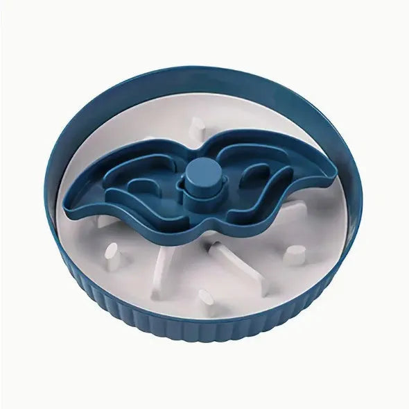Grey interactive pet slow feeder bowl with rotating centre holding a green silicone licking mat on a kitchen floor.