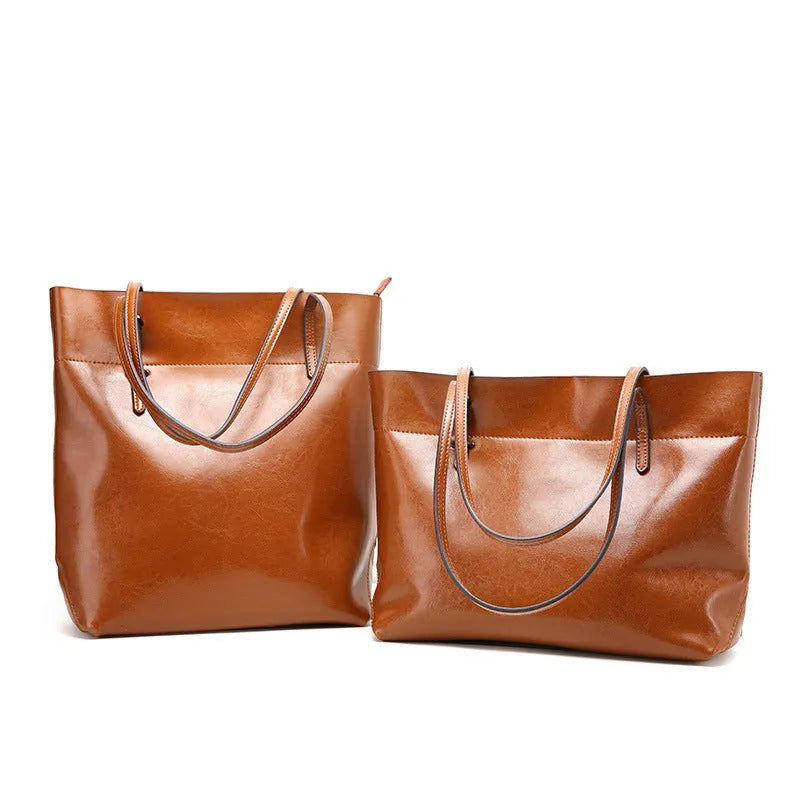 Brown waxed cowhide cross-body handbag showing front view, internal phone pocket, and adjustable leather strap.