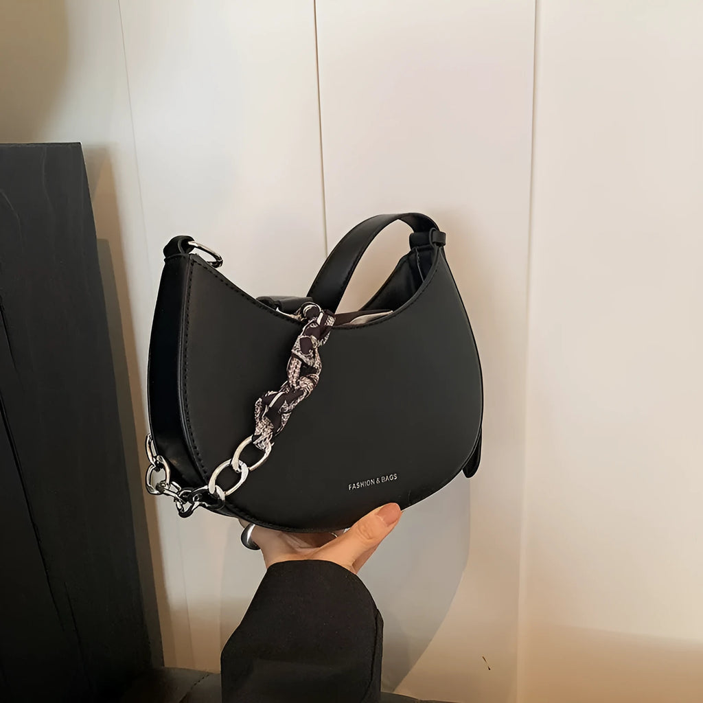 Small PU saddle shoulder bag with sandwich pocket and phone compartment, shown in black, brown, coffee, green, khaki or white.