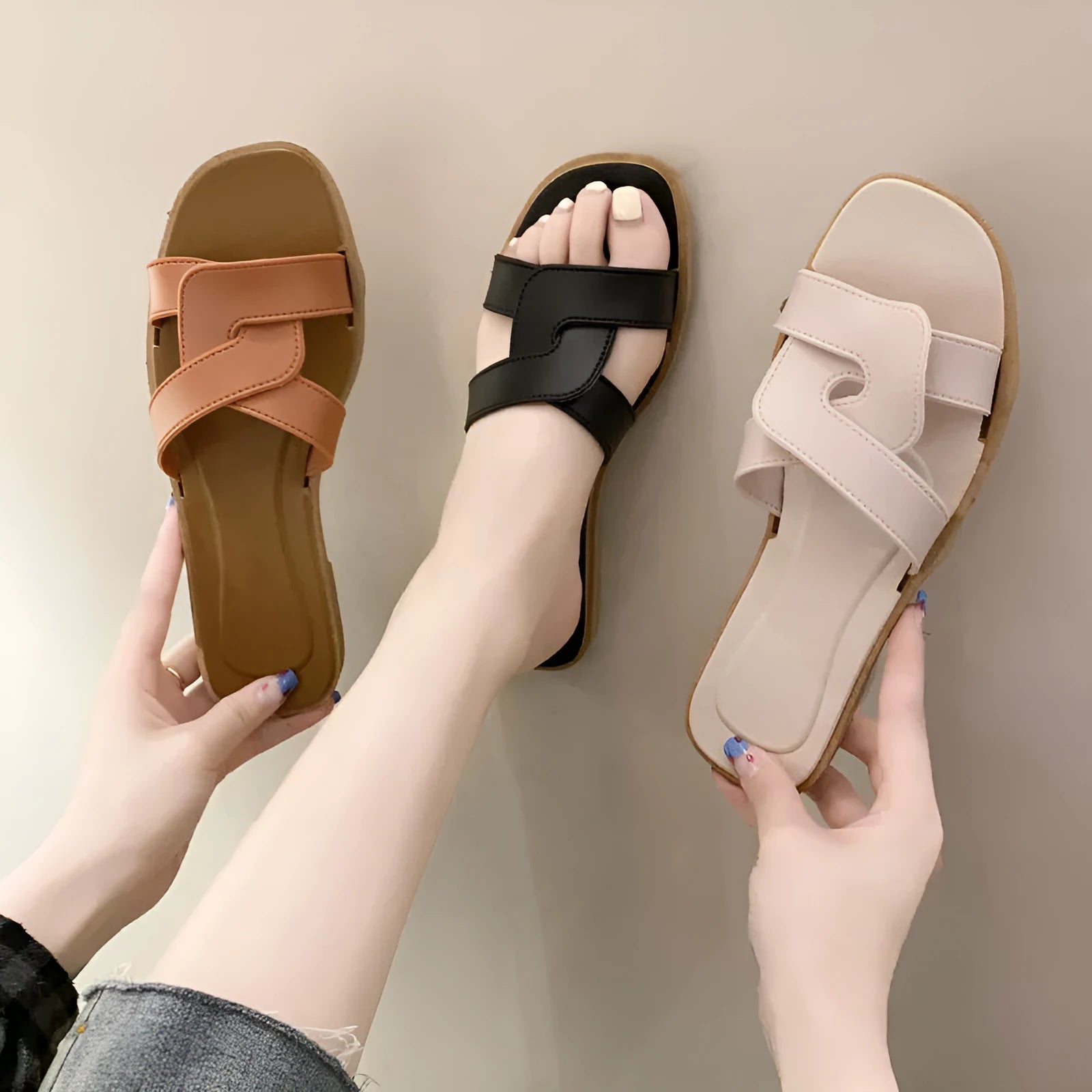 Women's PVC cross-strap flip flop sandals in light blue on a plain background.