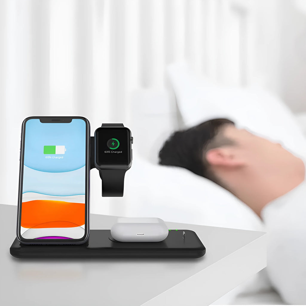 White three-in-one wireless charging station for phone, watch and headset on desktop