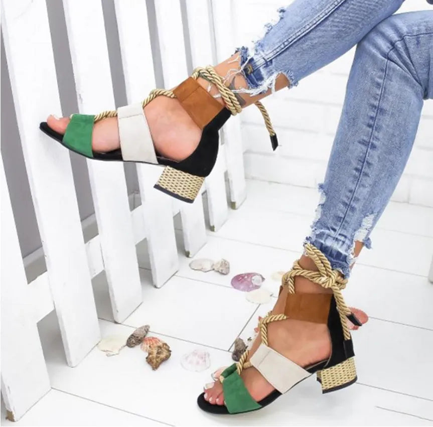 Women's beige suede sandals with thick heel, fish mouth toe, and front ankle strap.