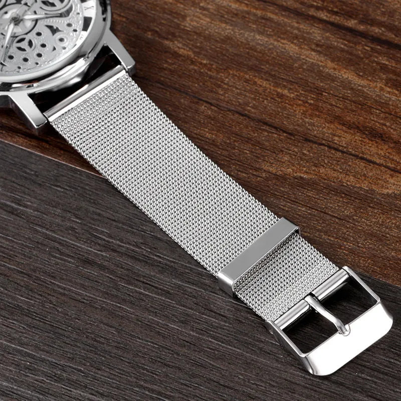 Men's non mechanical watch with hollow cross border design, black dial and simple strap on wrist