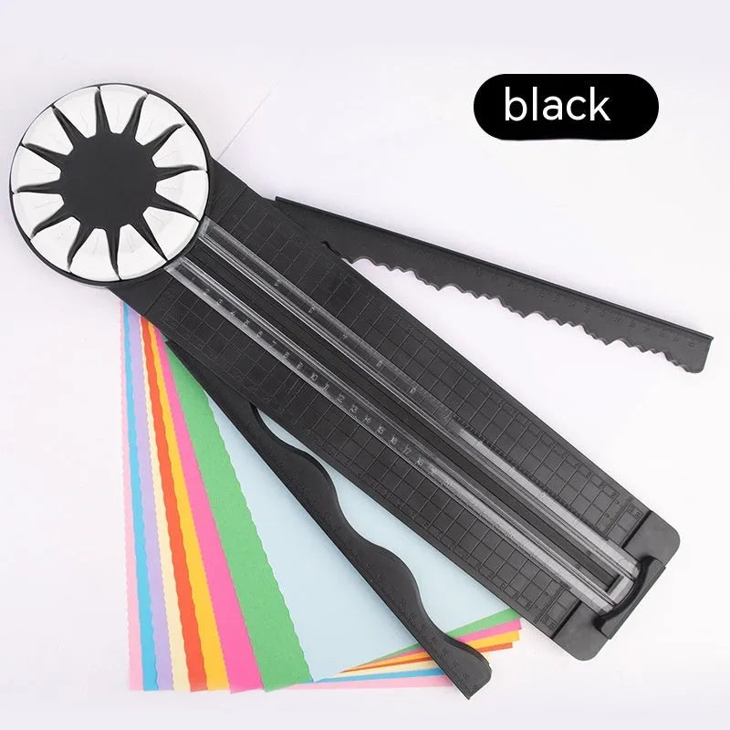 Pink plastic 12-in-1 paper cutting machine with dotted line and other pattern guides on a flat surface.