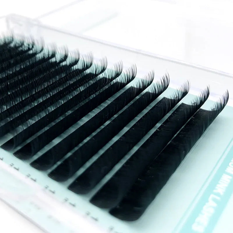 A pair of soft velvet false eyelashes made from artificial fibre, shown in various lengths from 7mm to 15mm.