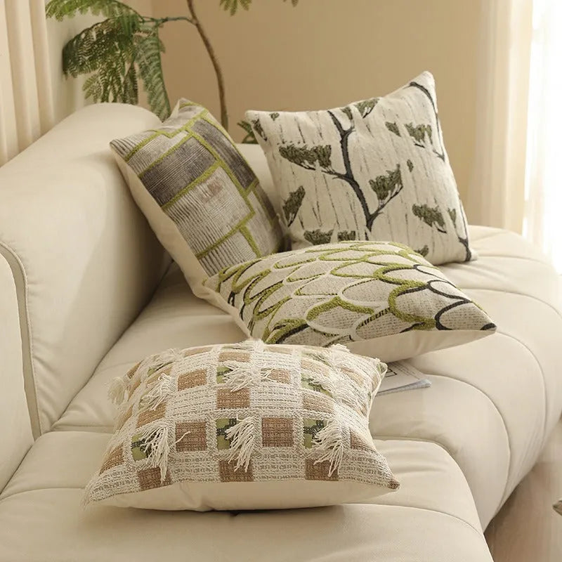 Square 45cm jacquard cushion cover with retro floral pattern in Nordic style on a grey sofa.