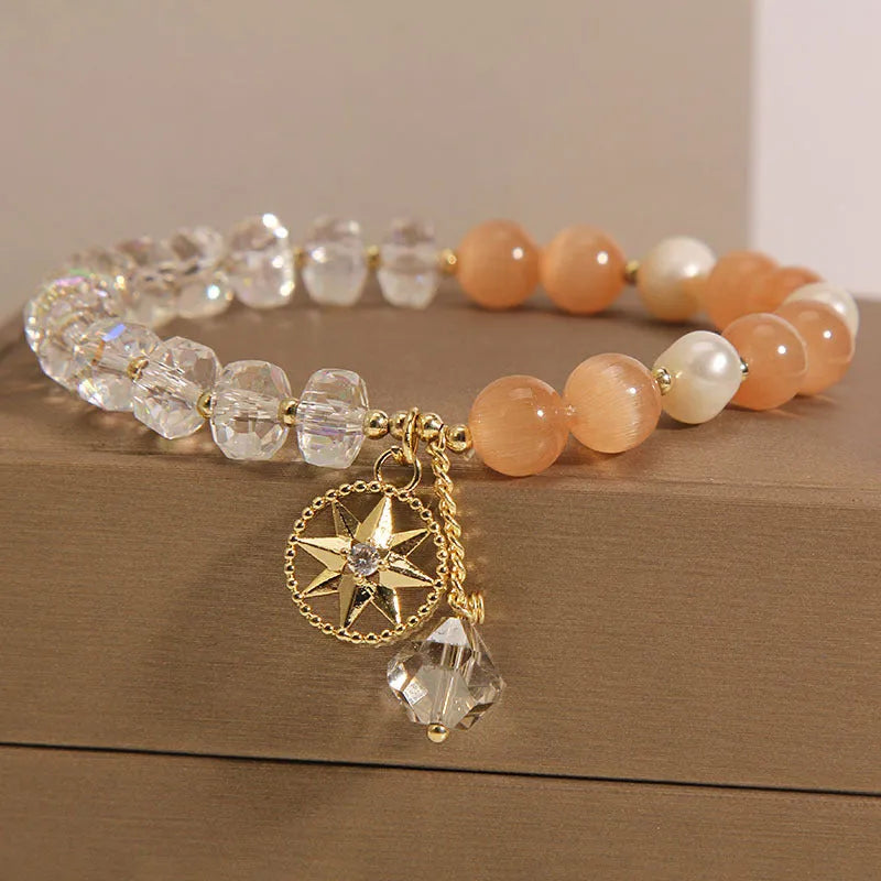 Orange women's bracelet with eight Awn star design featuring opal crystal and artificial gemstone inlay on gold-plated metal
