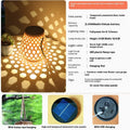 Outdoor solar lantern with imitation bamboo weaving shade casting decorative light patterns in a garden setting