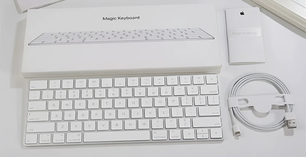 White Apple G6 Bluetooth wireless keyboard with ultra-thin metal design on desk