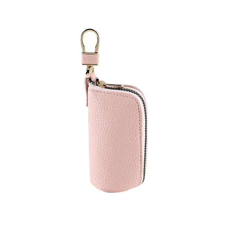 Black pu leather key case with silver zipper closure showing key ring inside