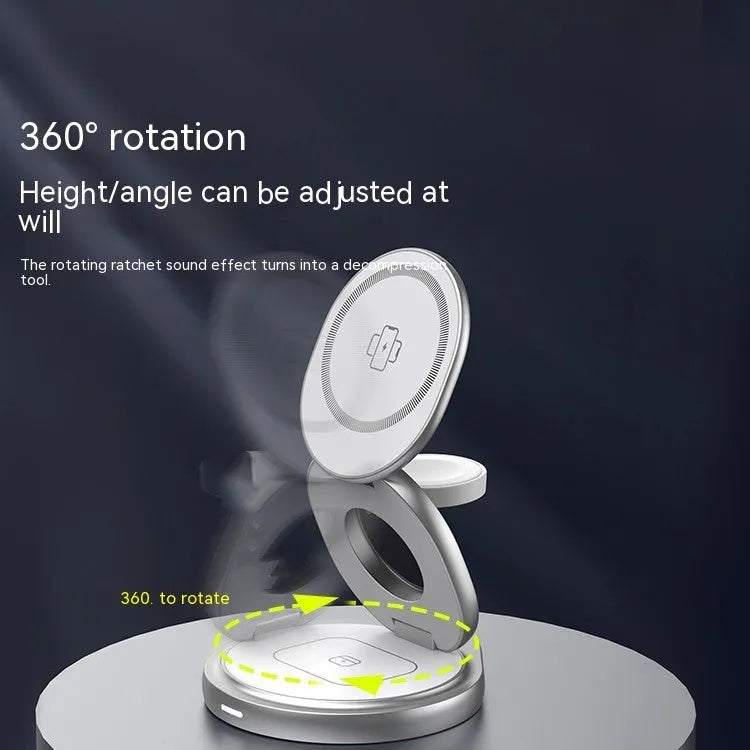 3-in-1 magnetic folding wireless charger stand in grey, with phone and headphones on a desk