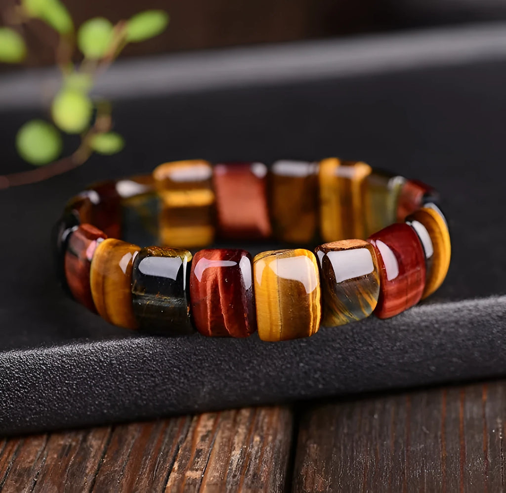 Natural tiger eye stone bracelet with round 14x10mm beads in red colour on a neutral background