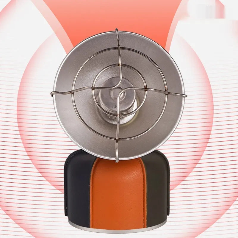 Black and orange mini portable outdoor gas heater stove with automatic ignition on a surface.