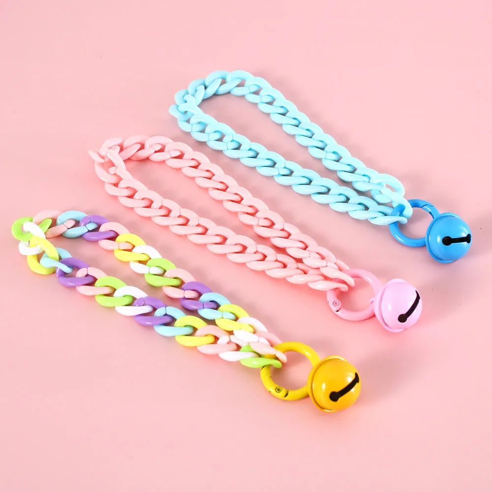 Macaron candy coloured plastic pet collar for cats, dogs and rabbits on a white background.