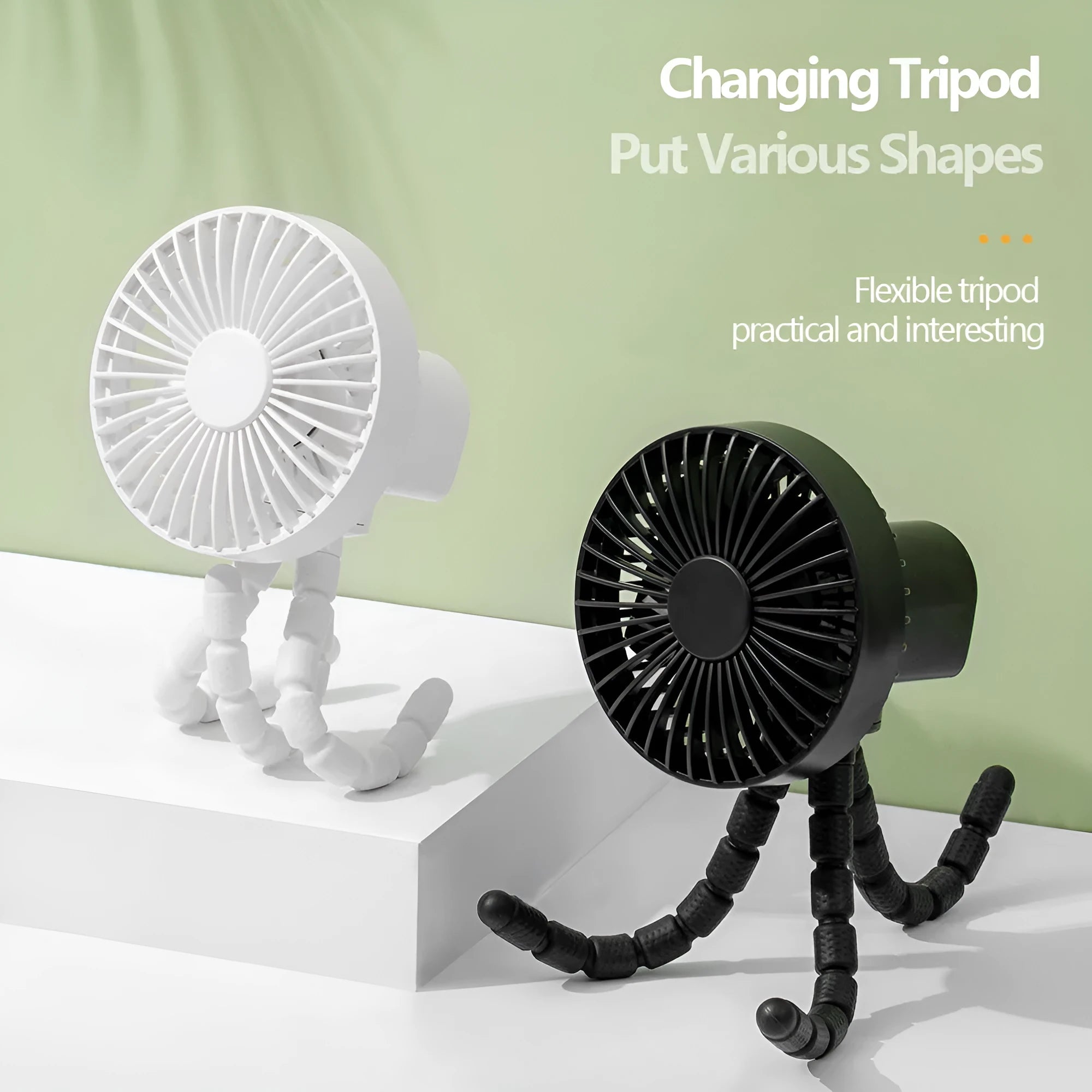 Small black adjustable tripod desktop fan with bending neck and clip, shown on a desk.