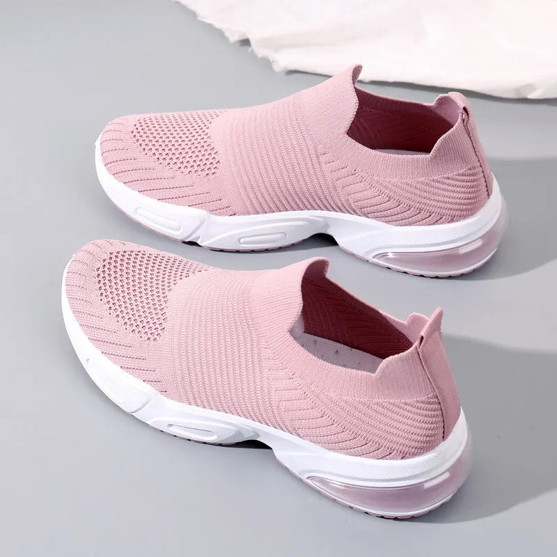 A pair of breathable mesh slip-on sock shoes with a PVC sole, shown in black colour.
