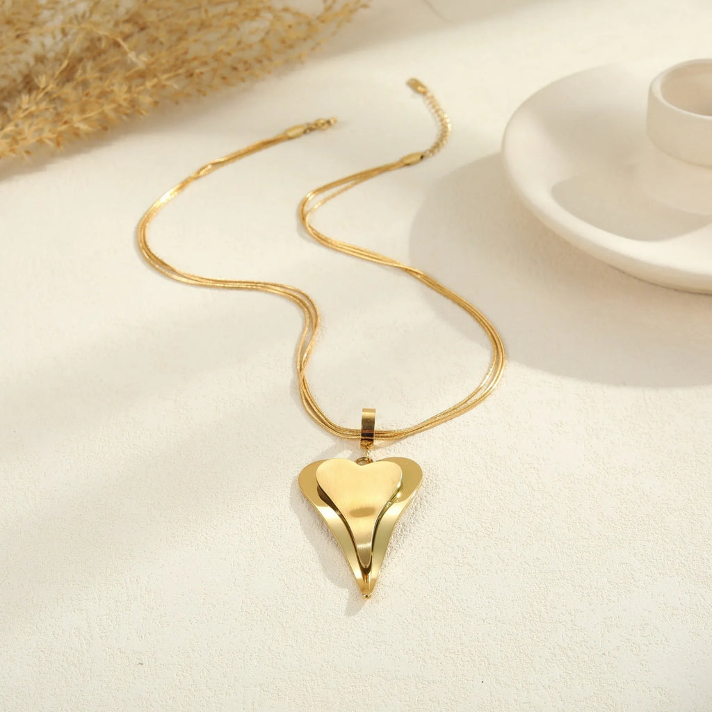 Stainless steel women's necklace with geometric double heart pendant on snake bones chain