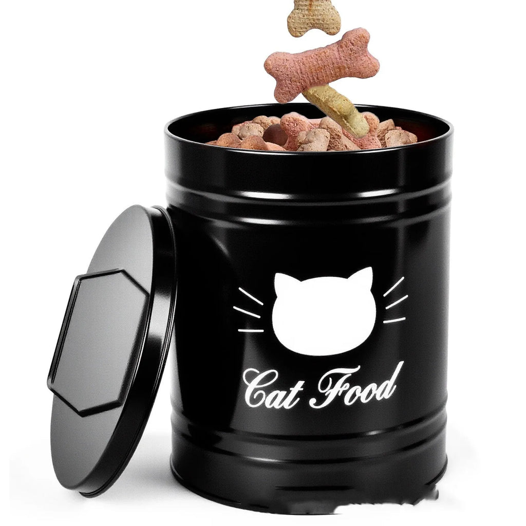 Round black iron sheet storage canister with lid on a kitchen shelf next to a white version.
