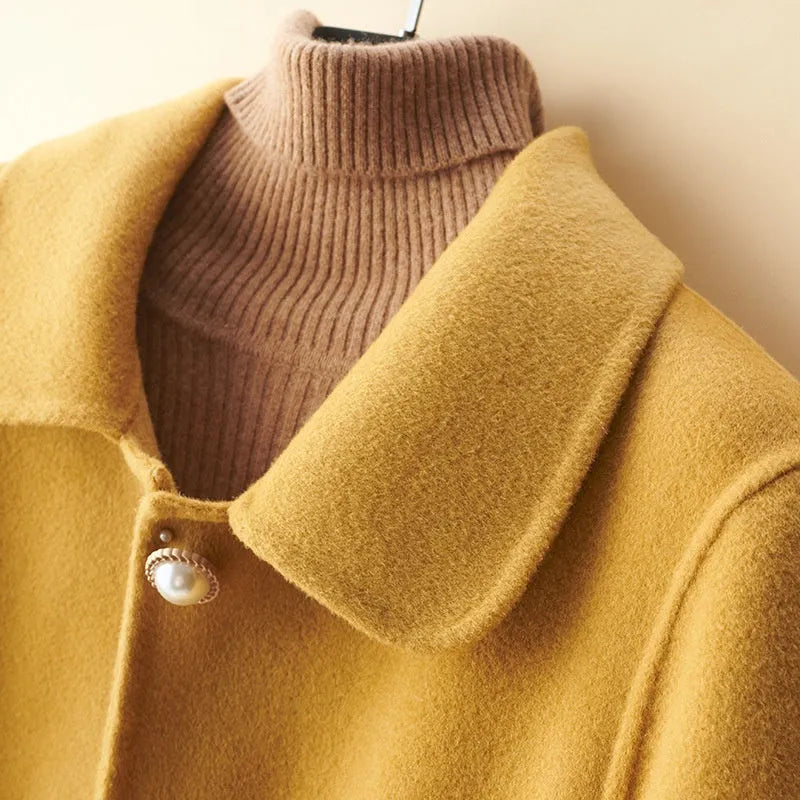 Women's double-faced wool coat with doll collar and pearl buckle in mid-length cut