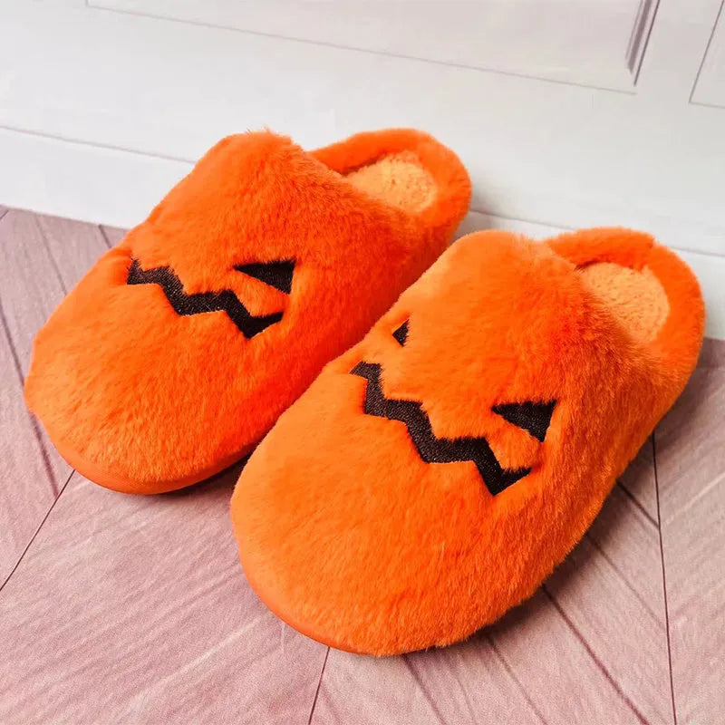 Orange women's Halloween pumpkin slippers with plush lining and a non-slip PVC sole