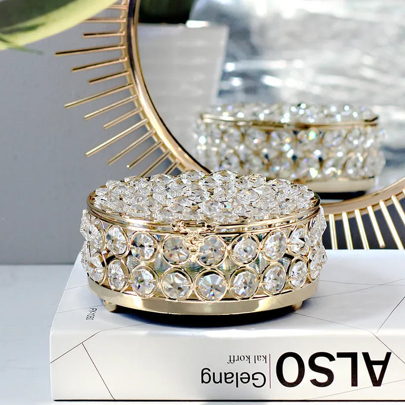 Transparent crystal glass jewelry box with a French gold metal frame in a European style.