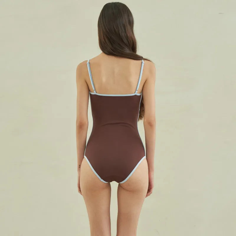 Brown nylon one-piece swimsuit for women with a triangular sexy design.