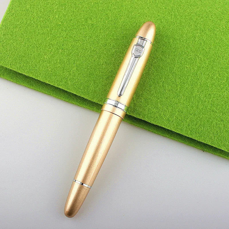 Metal ball pen with pearl beads, black body and silver clip, lying on a desk