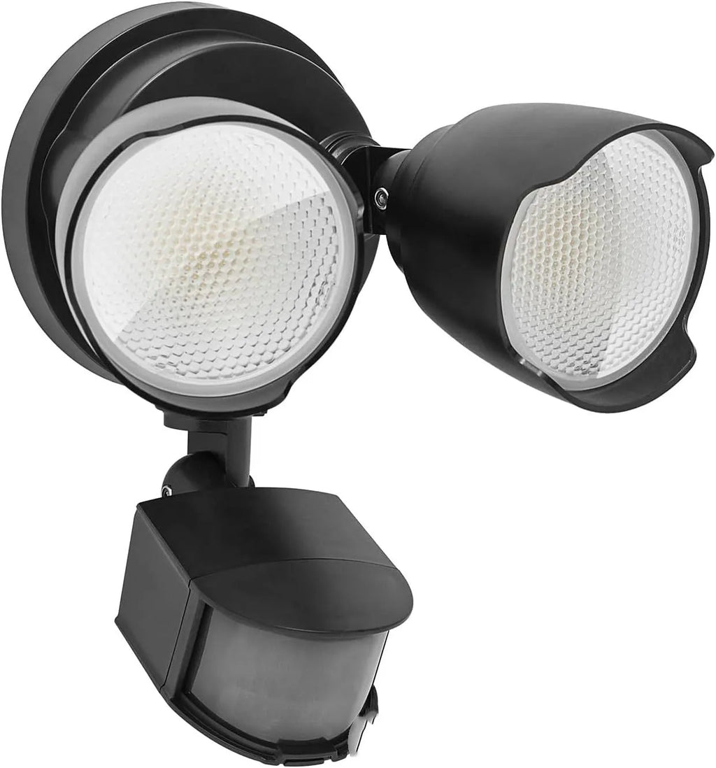 White outdoor LED security flood light with motion sensor mounted on a wall bracket