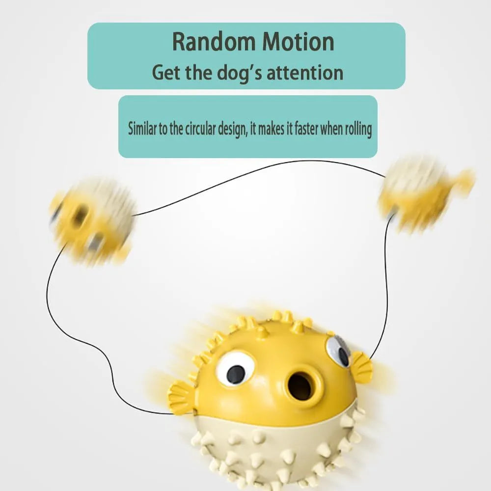 Green fish-shaped interactive dog toy with treat hole and textured surface, shown next to dog treats.
