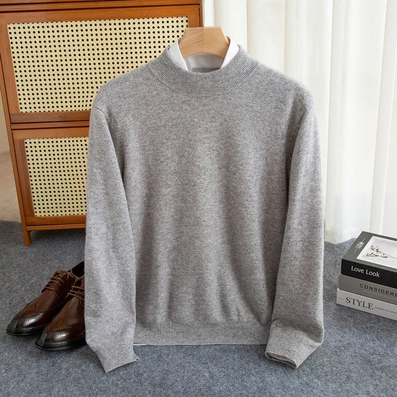 Man wearing a loose-fit half-collar wool sweater in a neutral colour, showing the knitted texture and relaxed fit.