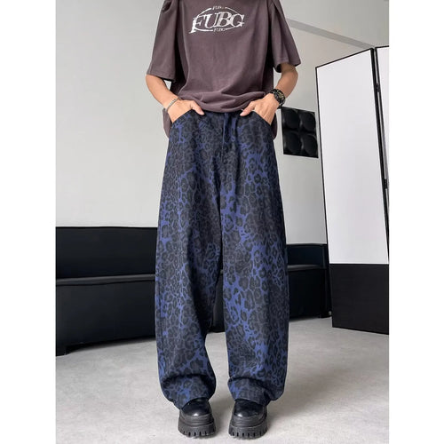 Blue cotton leopard print wide-leg pants with zip fly, full-length view