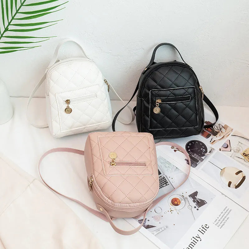 Girls' hard square PU backpack with embroidery in black, white, or pink, showing front and handle.