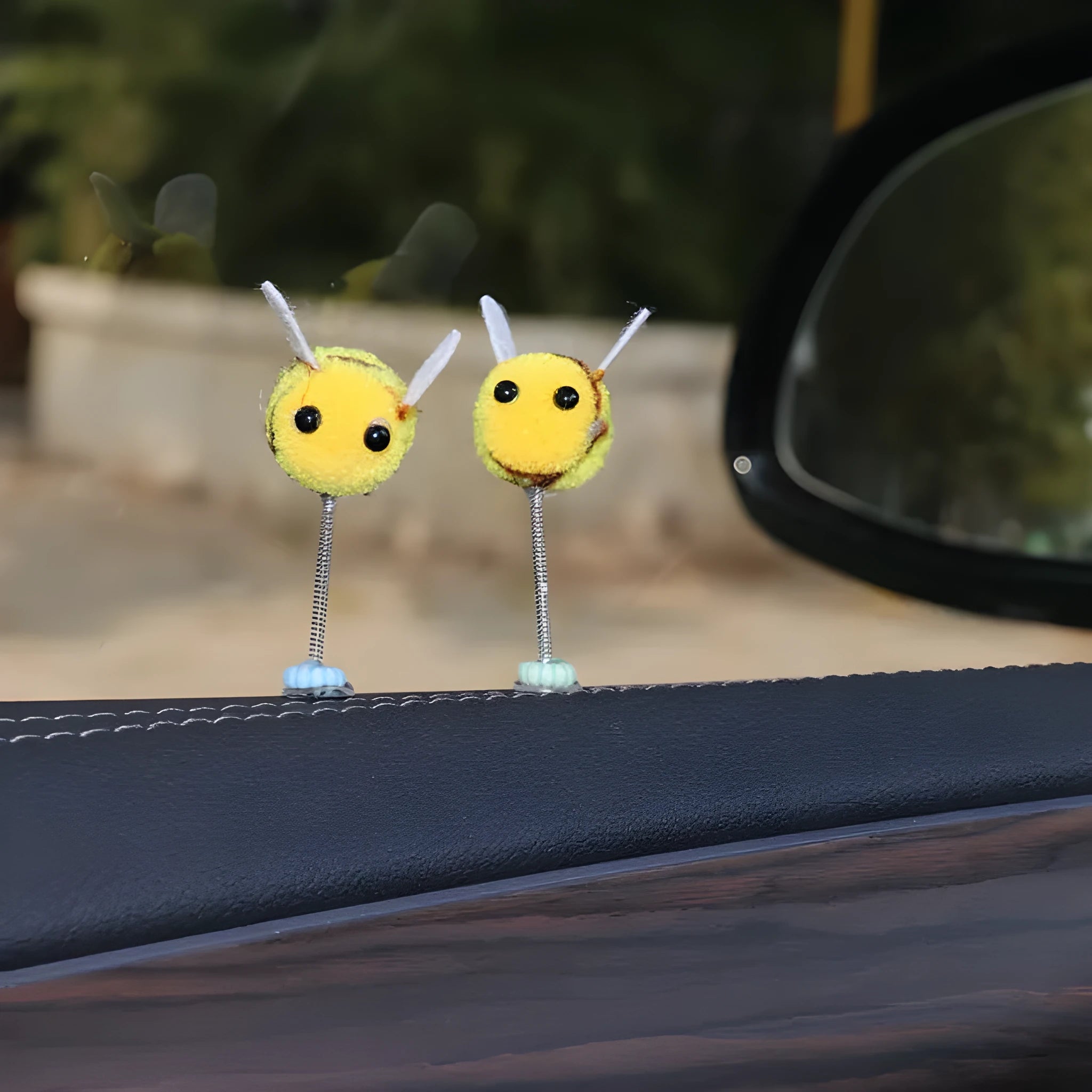Small fur ball bee car decoration measuring 3cm square with cartoon design