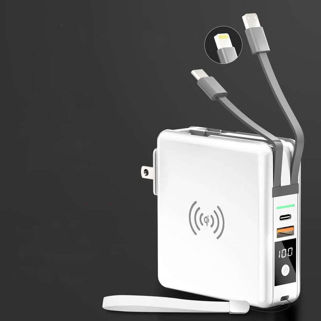 Super QI Power Bank showing fold-out UK, EU, US, and AU plug pins next to a smartphone on its wireless charging surface.