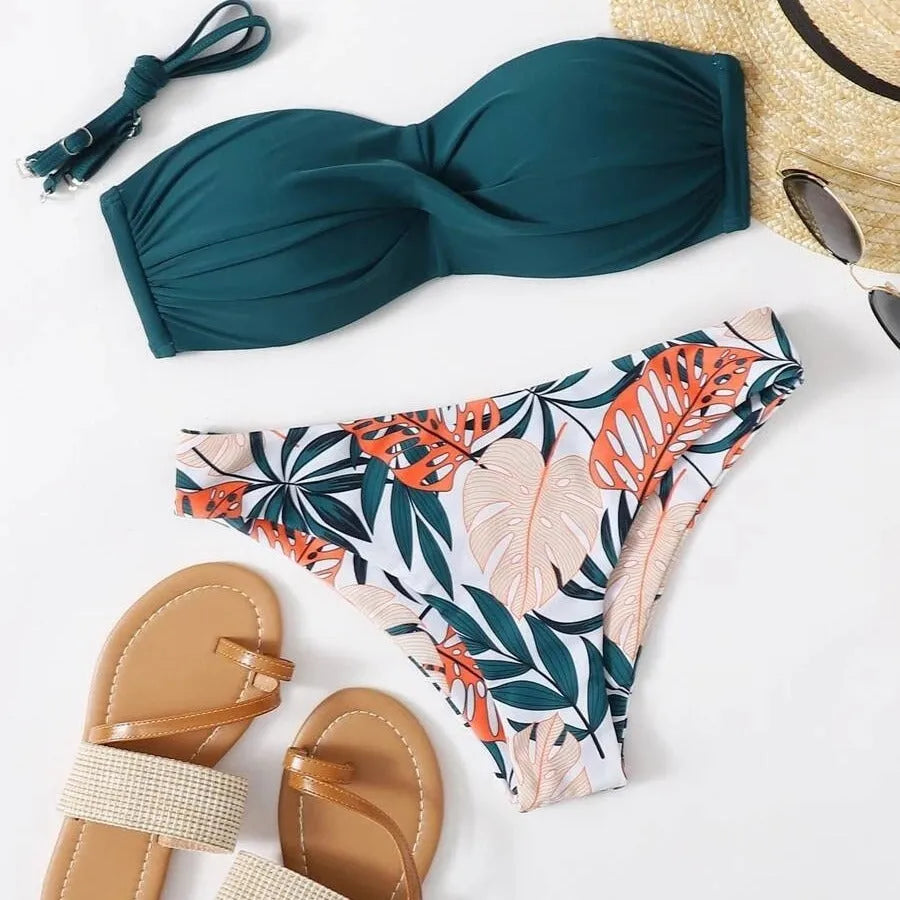 Green split push-up hard cup bikini top and coordinating briefs swimsuit laid flat.