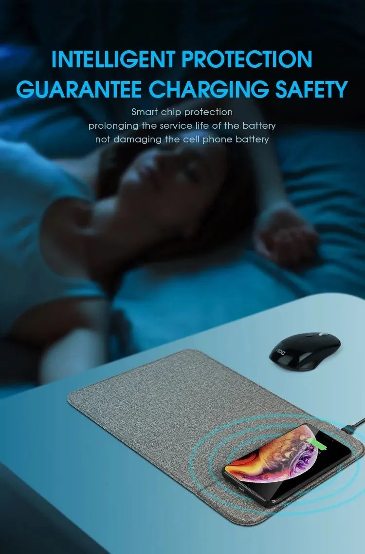 Grey foldable fabric phone holder with smartphone charging wirelessly on a wooden desk