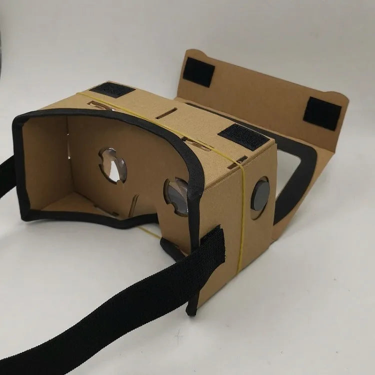 Pink and white cardboard VR glasses with adjustable rubber head strap and 3D lenses for smartphones.