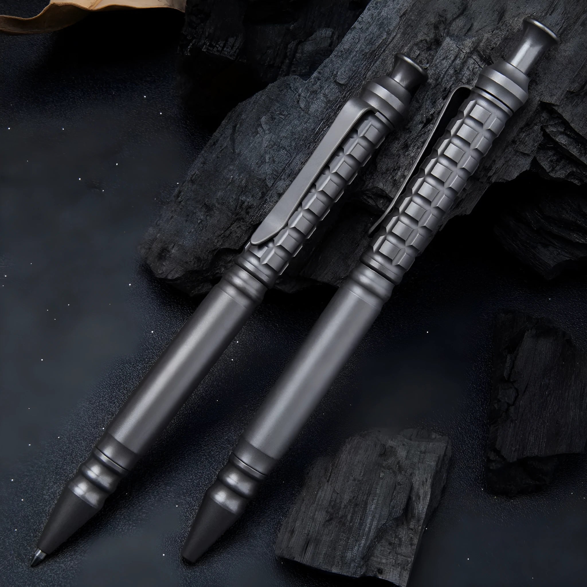 Gunmetal grey titanium alloy tactical pen with push-action decompression mechanism