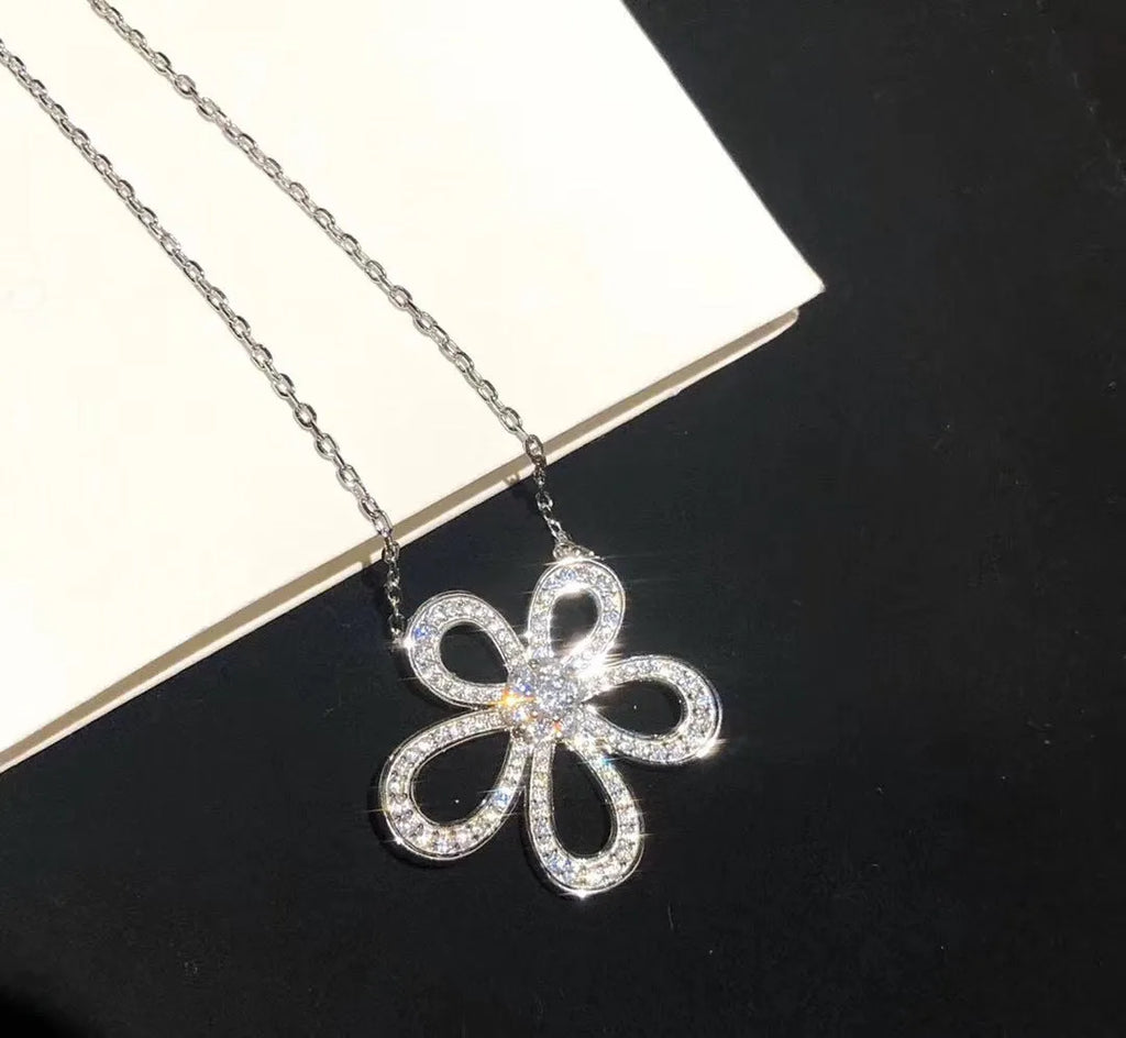 S925 sterling silver five petal jewellery set with necklace, ring, and earrings on white background