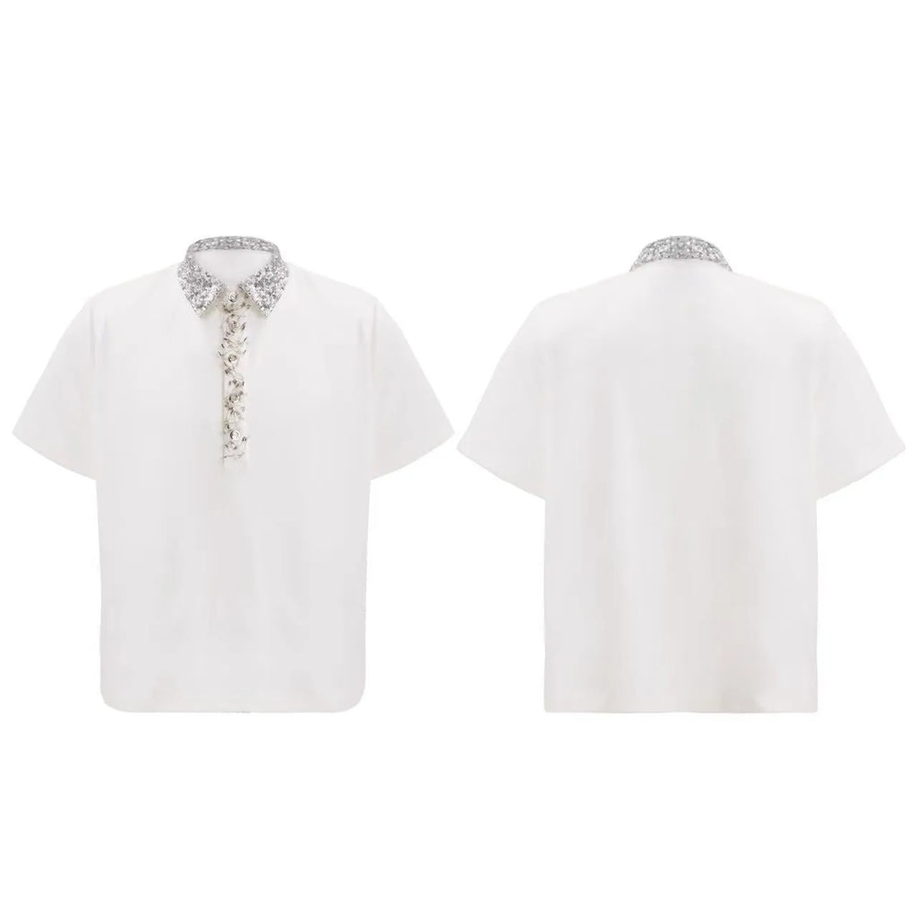 A man's black loose-fit polo t-shirt with heavy embroidery sequins detail and a square collar.