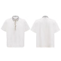 A man's black loose-fit polo t-shirt with heavy embroidery sequins detail and a square collar.