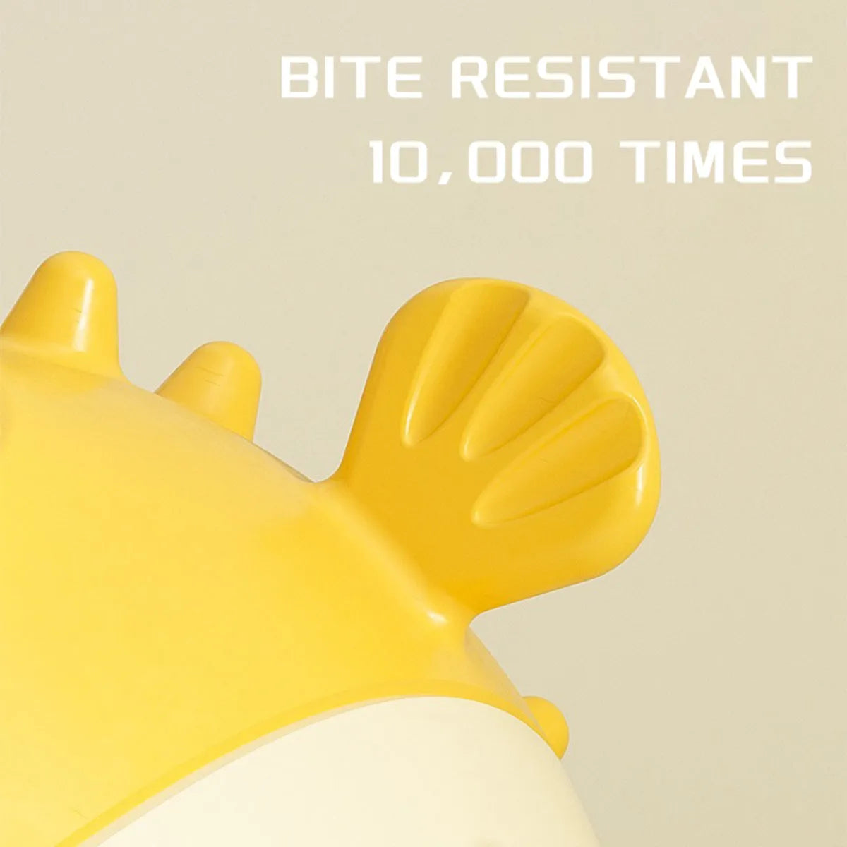 Yellow vinyl fish-shaped dog chew toy with textured surface and squeaker.