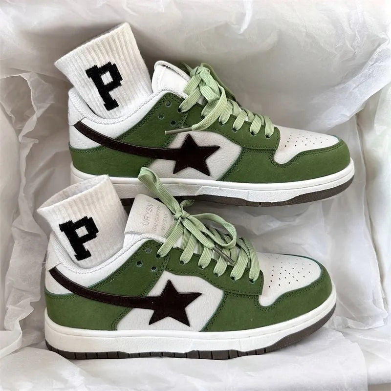 Women's retro green lace-up board shoes with round toe and flat rubber sole on a plain background