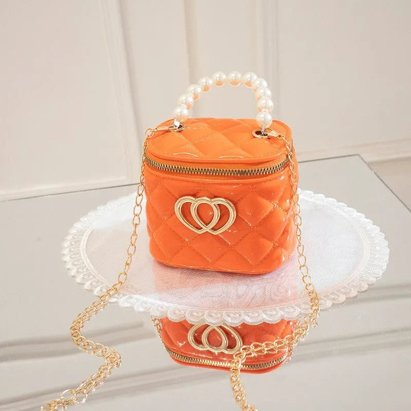 Women's heart-patterned PVC bucket gel bag in apricot colour with bucket shape