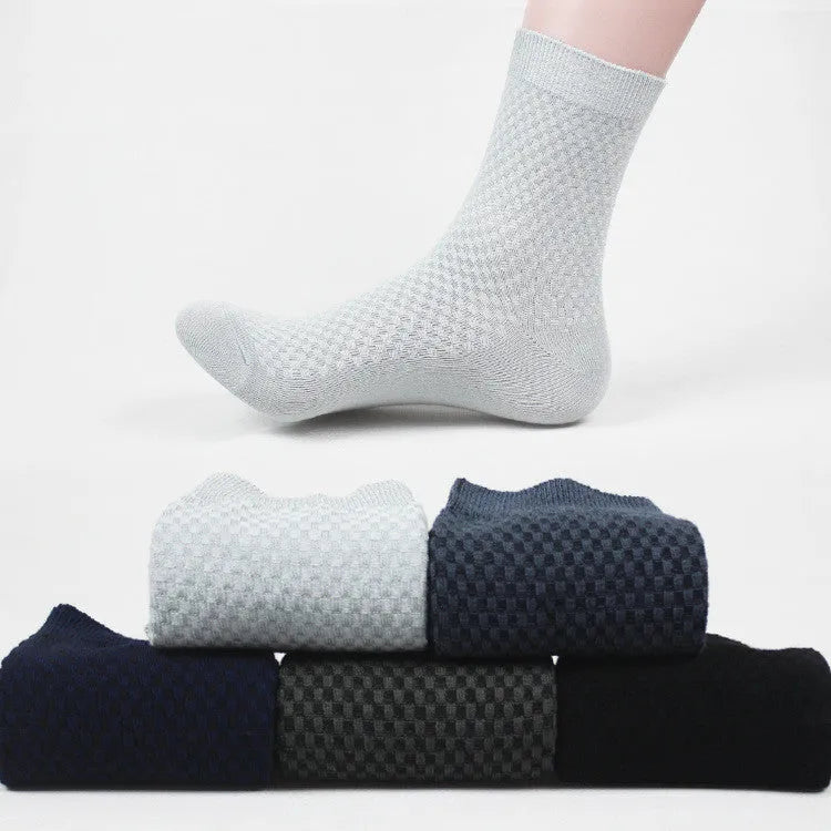 Men's bamboo fibre socks in black, navy, silver, iron grey, and grey blue with small square pattern.